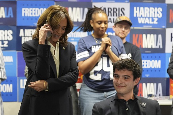 Democratic presidential nominee Vice President Kamala Harris, left, phone banks with volunteers at the DNC headquarters on Election Day, Tuesday, Nov. 5, 2024, in Washington. (AP Photo/Jacquelyn Marti ...