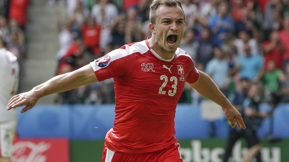 Switzerland&#039;s Xherdan Shaqiri, center, celebrates after scoring his sides first goal during the Euro 2016 round of 16 soccer match between Switzerland and Poland, at the Geoffroy Guichard stadiu ...