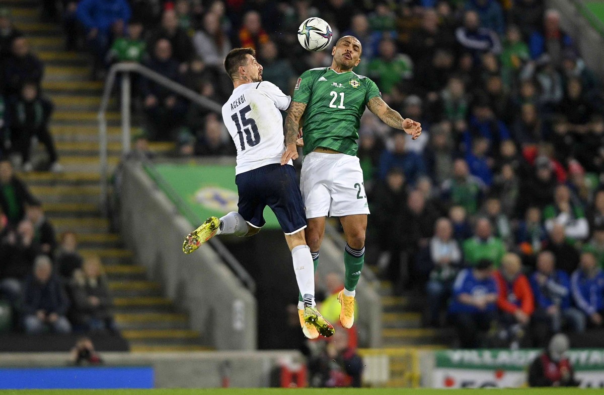 epa09583991 Northern Ireland's Josh Magennis (R) in action against Italy?s Francesco Acerbi (L) during the FIFA World Cup 2022 group C qualifying soccer match between Northern Ireland and Italy i ...