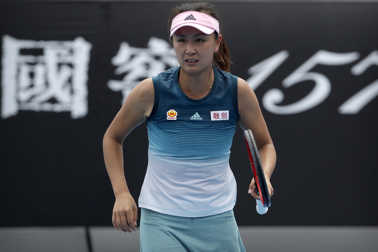 China&#039;s Peng Shuai reacts while competing against Canada&#039;s Eugenie Bouchard in their first round match at the Australian Open tennis championships in Melbourne, Australia, Tuesday, Jan. 15,  ...