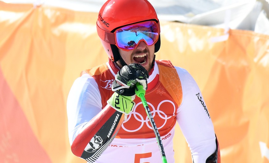 epa06538485 Gold medal winner Marcel Hirscher of Austria celebrates in the finish area after the second run of the Men&#039;s Giant Slalom race at the Yongpyong Alpine Centre during the PyeongChang 20 ...