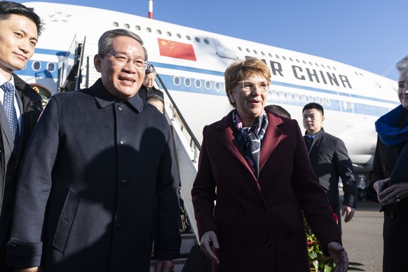 epa11076240 Swiss President Viola Amherd (R) welcomes Chinese Premier Li Qiang (2-L) and his delegation upon their arrival at Zurich Airport, Zurich Canton, Switzerland, January 14, 2024. The…