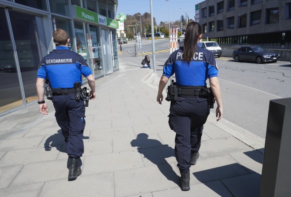 Officers of Lavaux police (APOL) and Vaud Gendarmerie are pictured during a patrol of the integrated police organization in Vaud County during the coronavirus disease (COVID-19) outbreak in Lausanne,  ...