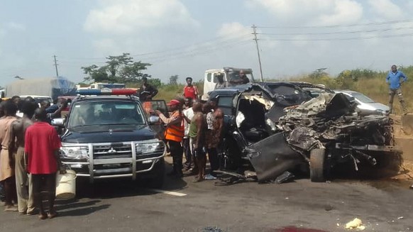 In this photo provided by the Federal Road Safety Corps, people gather at the accident scene of British boxer Anthony Joshua in Lagos, Nigeria, on Monday, Dec. 29, 2025. (Federal Road Safety Corps via ...