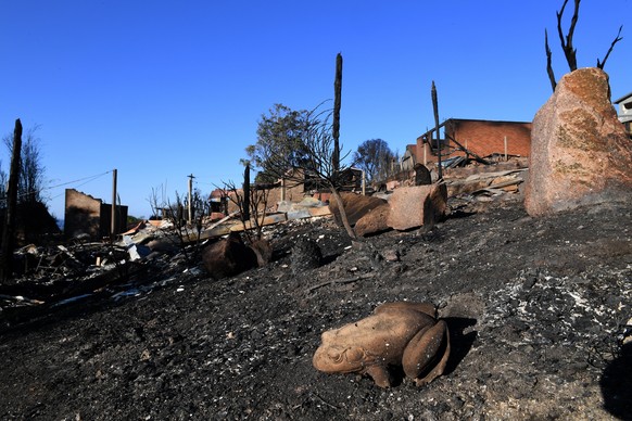 epa06614031 Some of the more than 70 houses and businesses destroyed by a bushfire in the coastal town of Tathra, New South Wales, Australia, 19 March 2018. Rural Fire Service and New South Wales Fire ...