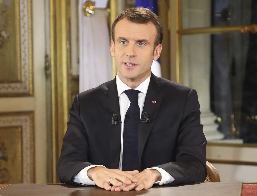 epa07222309 French President Emmanuel Macron speaks during a special address to the nation, his first public comments after four weeks of nationwide &#039;yellow vest&#039; (gilet jaune) protests, at  ...