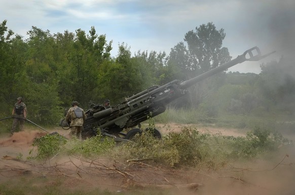 FILE - Ukrainian soldiers fire at Russian positions from a U.S.-supplied M777 howitzer in Ukraine&#039;s eastern Donetsk region, June 18, 2022. The deliveries of Western weapons have been crucial for  ...