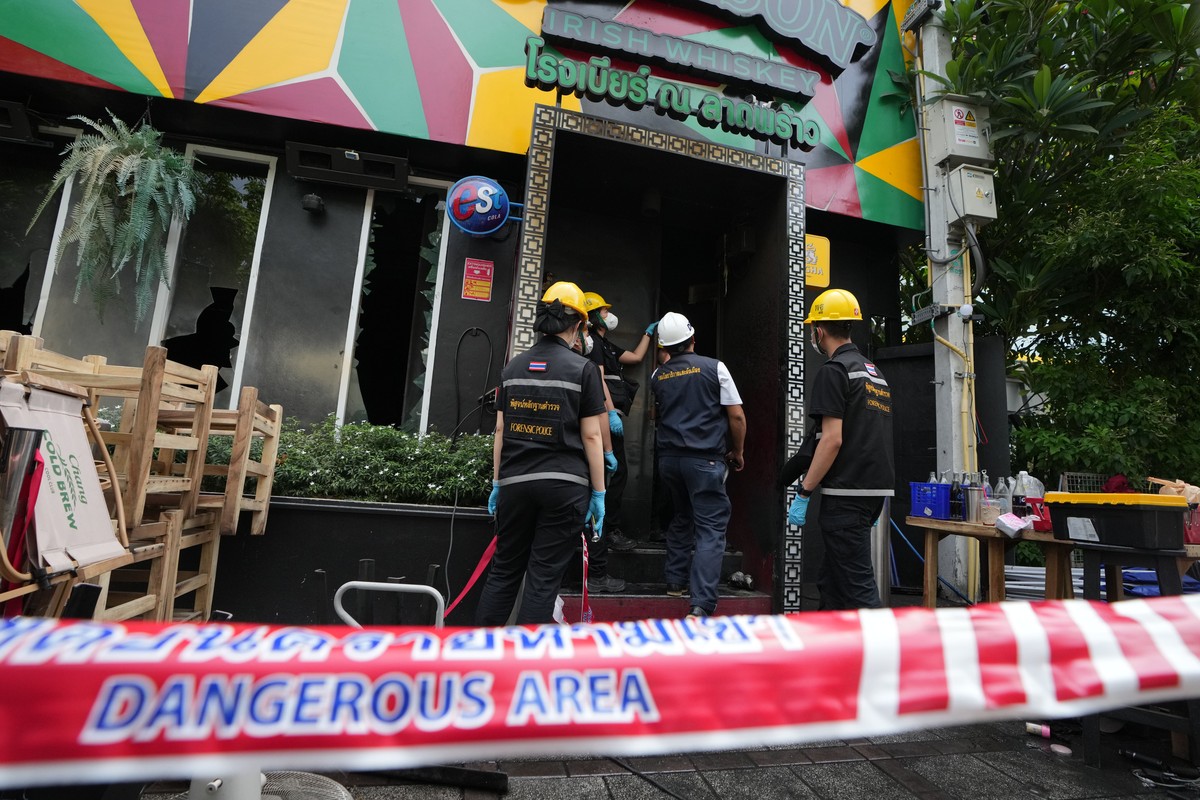 Forensic police officers inspect the site of a fire in Bangkok, Thailand, Monday, July 13, 2026. (AP Photo/Sakchai Lalit)
Thailand Fire
