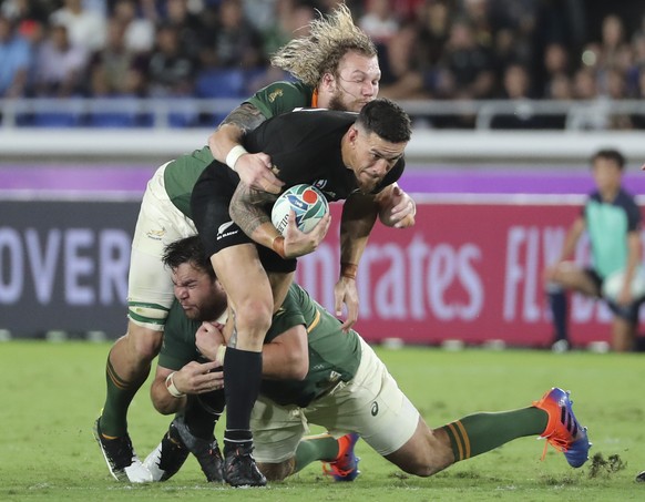 New Zealand&#039;s Sonny Bill Williams, center, is tackled during their match against South Africa at the Rugby World Cup Pool B game in Yokohama, Japan, Saturday, Sept. 21, 2019. (AP Photo/Koji Sasah ...