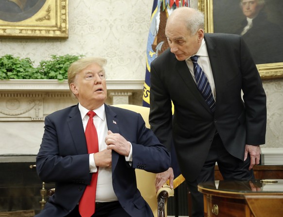 White House Chief of Staff John Kelly, right, leans in to talk with President Donald Trump during Trump&#039;s meeting with Portuguese President Marcelo Rebelo de Sousa, in the Oval Office of the Whit ...
