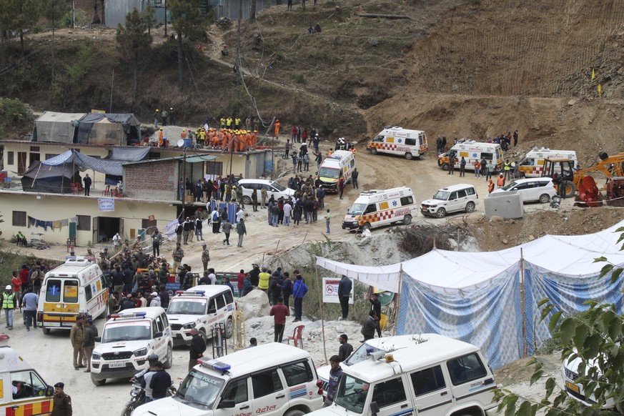 Ambulances wait to carry workers from the site of an under-construction road tunnel that collapsed in Silkyara in the northern Indian state of Uttarakhand, India, Tuesday, Nov. 28, 2023. Officials in  ...