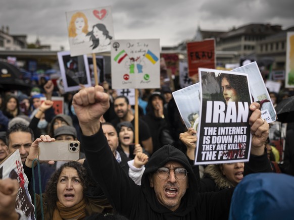 People protest against the death of Iranian Mahsa Amini, in Zurich, Switzerland, on Saturday Oct. 1, 2022. Amini, a 22-year-old woman who died in Iran while in police custody, was arrested by Iran&#03 ...