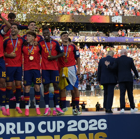 Spain players, from left, cheer alongside President Donald Trump and FIFA President Gianni Infantino at the conclusion of the World Cup championship final soccer match between Spain and Argentina in E ...