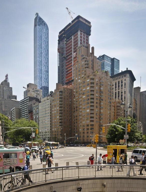 FILE- In this May 26, 2016 file photo, a crane sits atop ongoing construction for a new condominium skyscraper at 220 Central Park South in New York. Citadel hedge fund founder Ken Griffin, a billiona ...