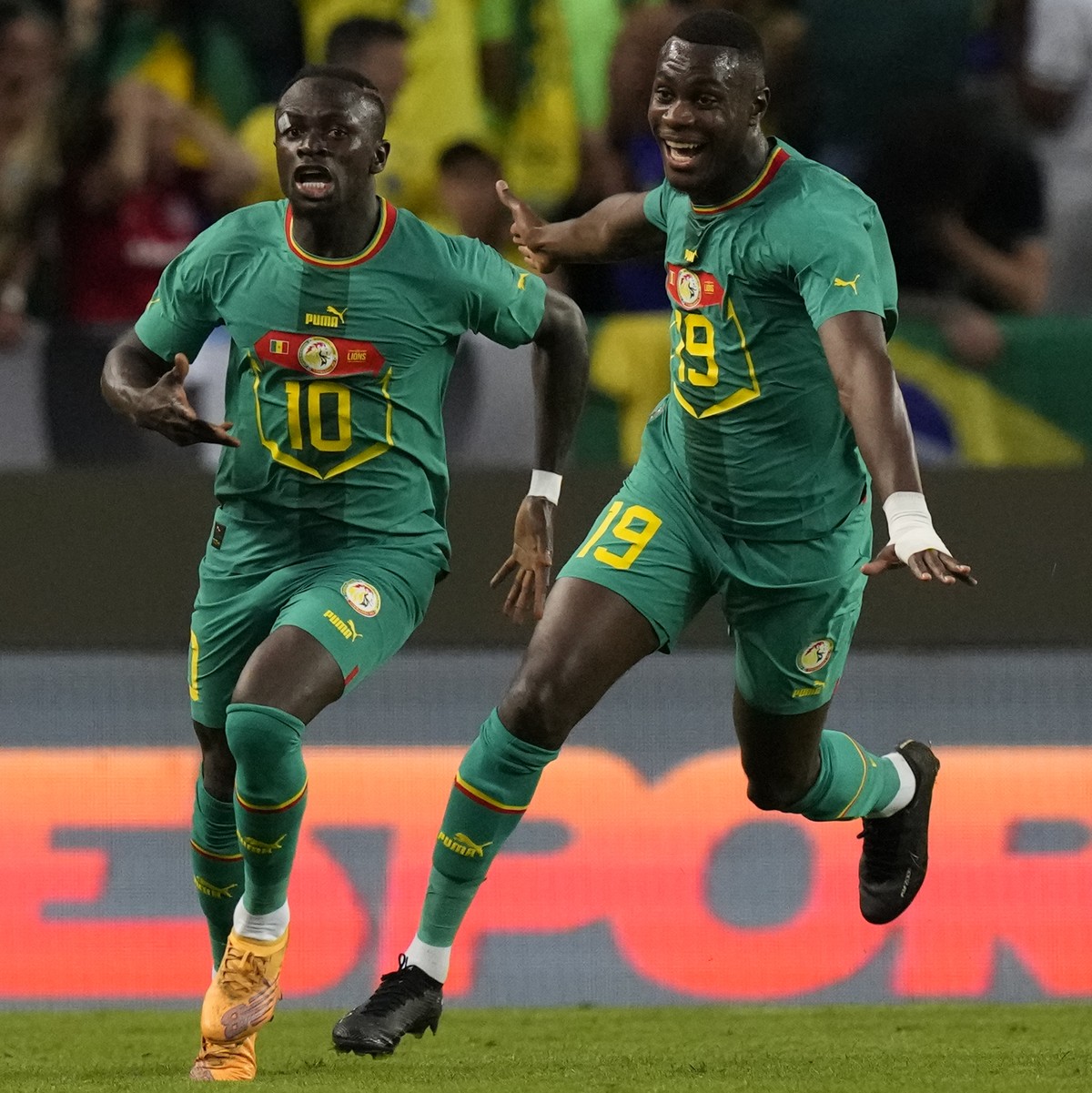 Senegal's Sadio Mane, centre, celebrates after scoring his side's third goal during the international friendly soccer match between Brazil and Senegal, at the Alvalade Stadium in Lisbon, Por ...