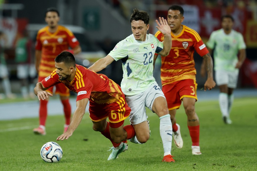 North Macedonia's Visar Musliu, left, fights for the ball with Switzerland's Fabian Rieder, center, and North Macedonia's Sebastijan Herera, right,, during the UEFA Nations League socce ...