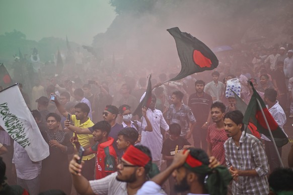 KEYPIX - People use colored sprays as they gather to commemorate &quot;July Uprising Day&quot; marking the anniversary of the fall of the Awami League government, in Dhaka, Bangladesh, Tuesday, Aug. 5 ...