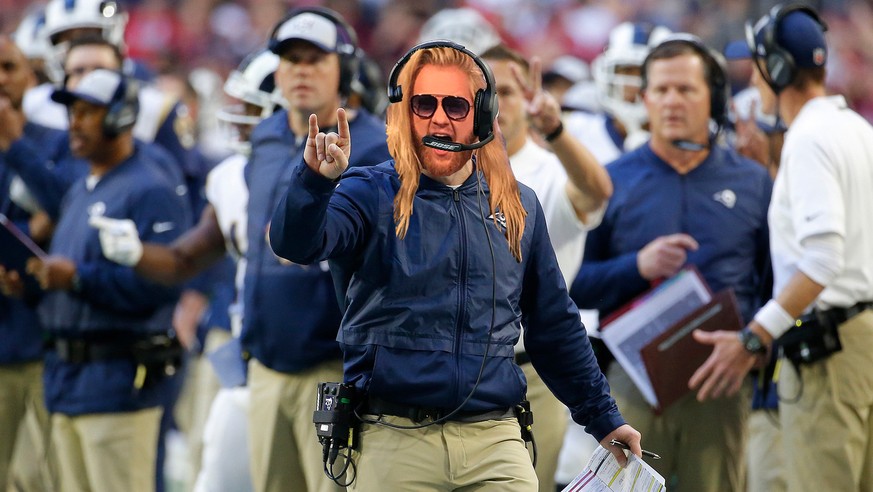 Los Angeles Rams head coach Sean McVay makes a call against the Arizona Cardinals during the second half of an NFL football game, Sunday, Dec. 23, 2018, in Glendale, Ariz. (AP Photo/Rick Scuteri)