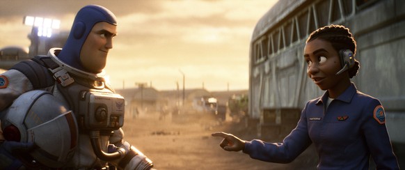 This image released by Disney/Pixar shows character Buzz Lightyear, voiced by Chris Evans, left, and Alisha Hawthorne, voiced by Uzo Aduba, in a scene from the animated film &quot;Lightyear,&quot; rel ...