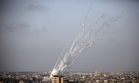 Rockets are launched from the Gaza Strip toward Israel, Monday, May. 10, 2021. (AP Photo/Khalil Hamra)