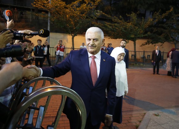 Istanbul&#039;s mayoral candidate Binali Yildirim, of Turkey&#039;s ruling Justice and Development Party, or AKP, waves as he arrives for a televised debate with Ekrem Imamoglu, candidate of the secul ...