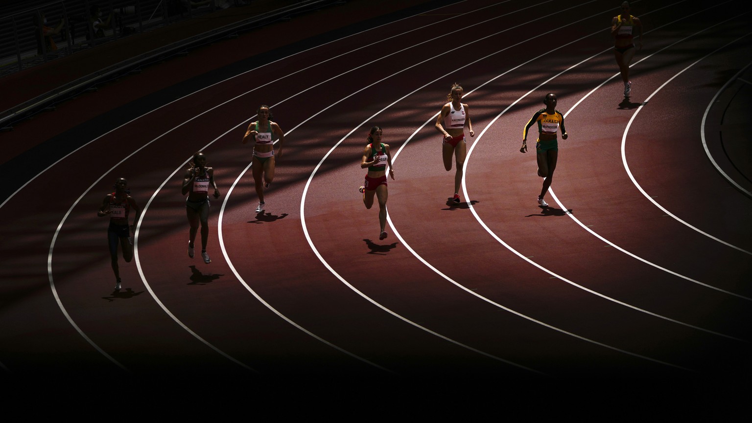 Athletes compete in their heat of the women&#039;s 400-meters at the 2020 Summer Olympics, Tuesday, Aug. 3, 2021, in Tokyo. (AP Photo/Francisco Seco)