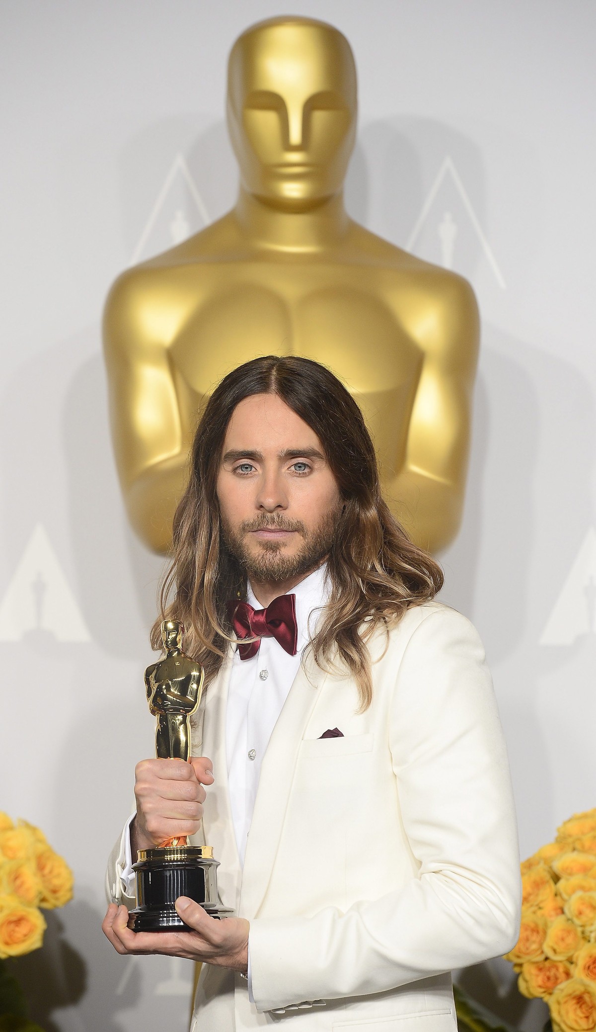 epa04107243 US actor and singer Jared Leto holds the award for Best Performance by an Actor in a Supporting Role for 'Dallas Buyers Club' in the press room during the 86th annual Academy Awa ...