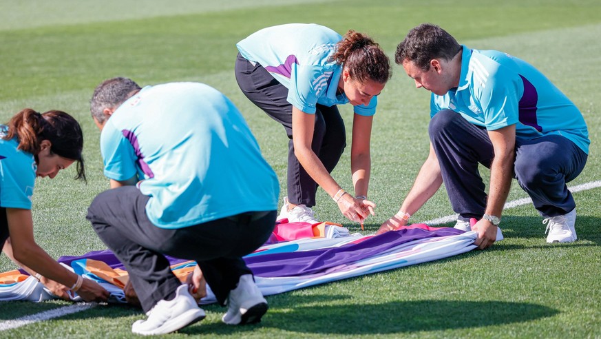 03th July 2025, Stade de Tourbillon: Volunteers enter the field for the match presentation during the UEFA Womens EURO 2025 Group B match between Belgium and Italy at Stade de Tourbillon in Sion, Swit ...