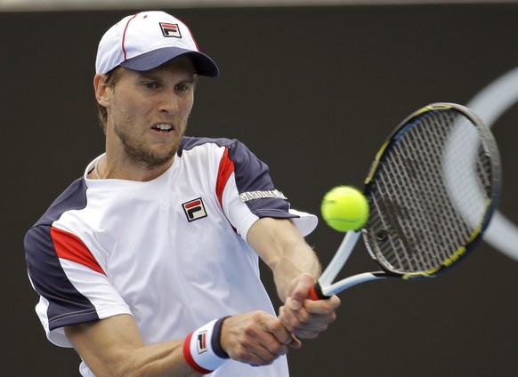 Italy&#039;s Andreas Seppi makes a backhand return to Belgium&#039;s Steve Darcis during their third round match at the Australian Open tennis championships in Melbourne, Australia, Friday, Jan. 20, 2 ...