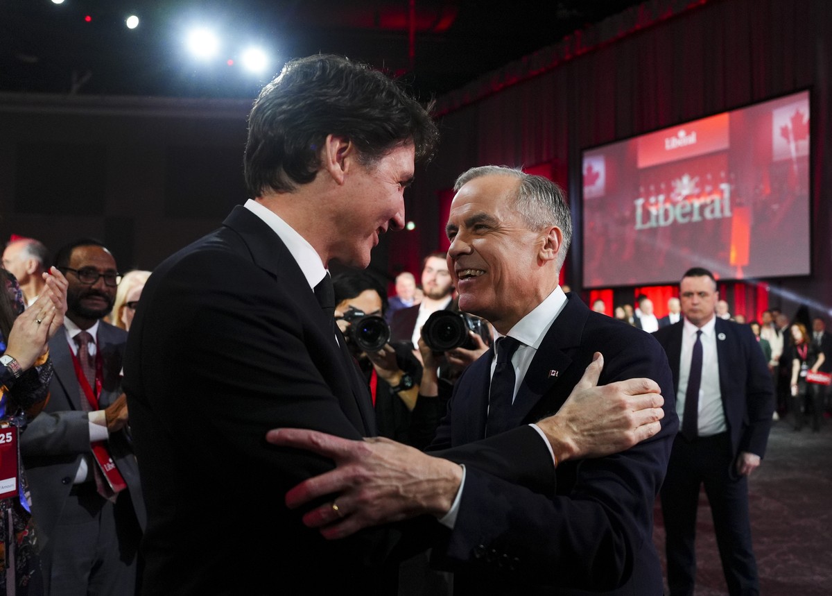 Liberal Party of Canada Leader Mark Carney, right, speaks to Canadian Prime Minister Justin Trudeau after Carney was announced as the winner of the party leadership at the announcement event in Ottawa ...