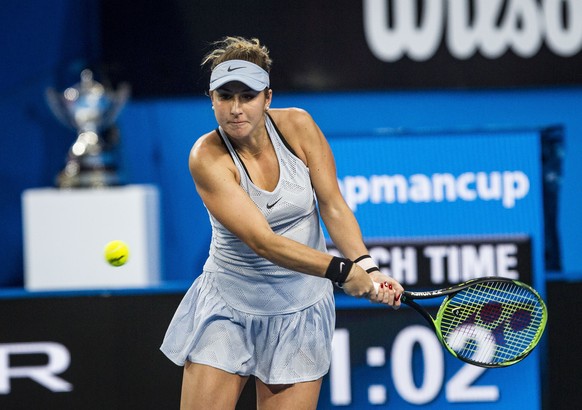 epa06419691 Belinda Bencic of Switzerland returns the ball to Angelique Kerber of Germany during the women&#039;s singles match of the Hopman Cup final between Switzerland and Germany at the Perth Are ...