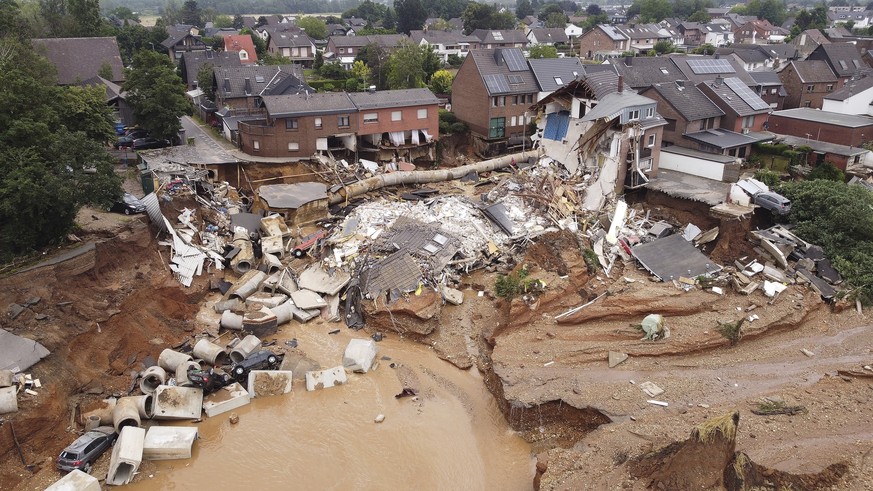 Debris of collapsed houses is pictured in the Blessem district of Erftstadt, Germany, Friday, July 16, 2021. Heavy rains caused mudslides and flooding in the western part of Germany. Multiple have die ...