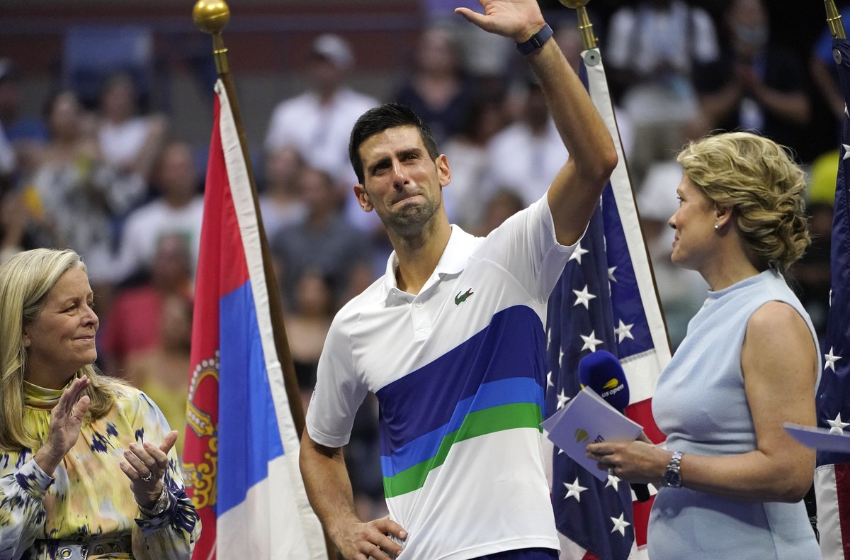 Novak Djokovic, of Serbia, center, waves to the crowd after losing to Daniil Medvedev, of Russia, in the men's singles final of the US Open tennis championships, Sunday, Sept. 12, 2021, in New Yo ...
