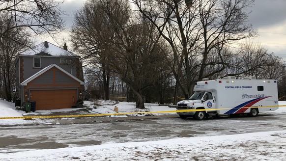 In this Saturday, Feb. 3, 2018 photo, crime scene tape surrounds a property where police say they recovered the remains of at least six people from planters on the property which is connected to alleg ...