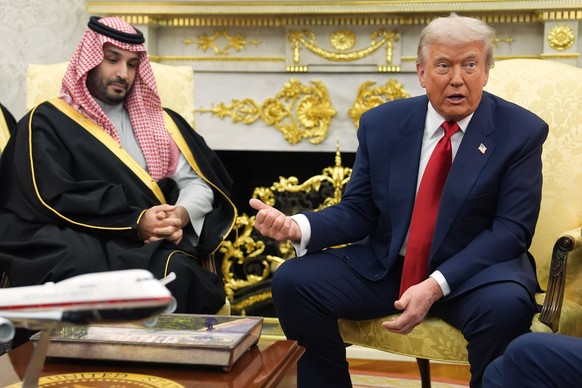 President Donald Trump gestures to Saudi Arabia&#039;s Crown Prince Mohammed bin Salman as they meet in the Oval Office of the White House, Tuesday, Nov. 18, 2025, in Washington. (AP Photo/Evan Vucci) ...