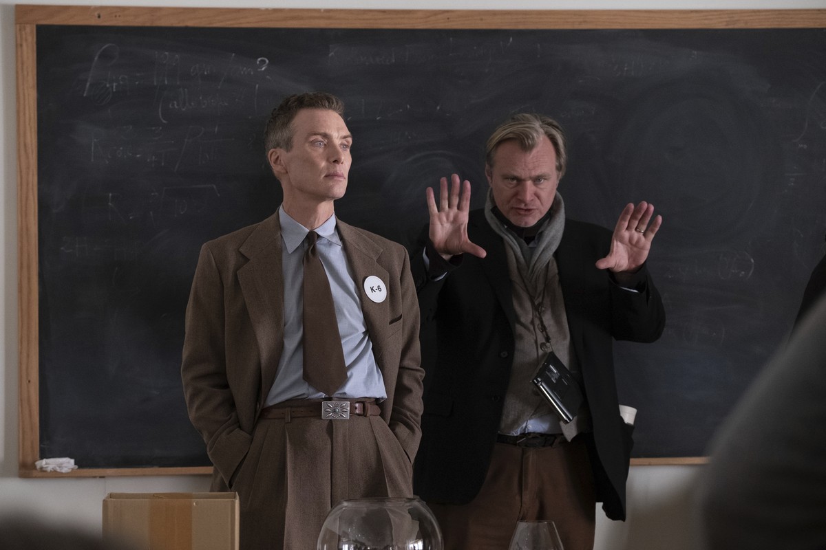 This image released by Universal Pictures shows writer-director-producer Christopher Nolan, right, and actor Cillian Murphy on the set of "Oppenheimer." (Melinda Sue Gordon/Universal Picture ...
