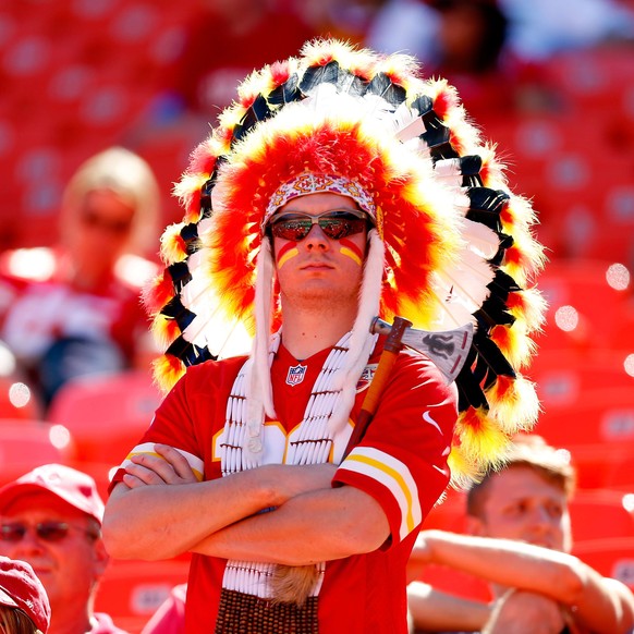 KANSAS CITY, MO - SEPTEMBER 07: A Kansas City Chiefs fan stands towards the end of the game against the Tennessee Titans at Arrowhead Stadium on September 7, 2014 in Kansas City, Missouri. Wesley Hitt ...