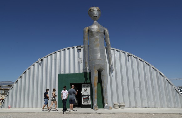 People enter and exit the Alien Research Center in Hiko, Nev. No one knows what to expect, but lots of people are preparing for &quot;Storm Area 51&quot; on Wednesday, Sept. 18, 2019, in the Nevada de ...