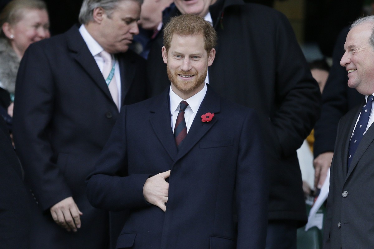 Britain's Prince Harry smiles before a rugby union international match between England and Argentina at Twickenham stadium in London, Saturday, Nov. 11, 2017. (AP Photo/Tim Ireland)