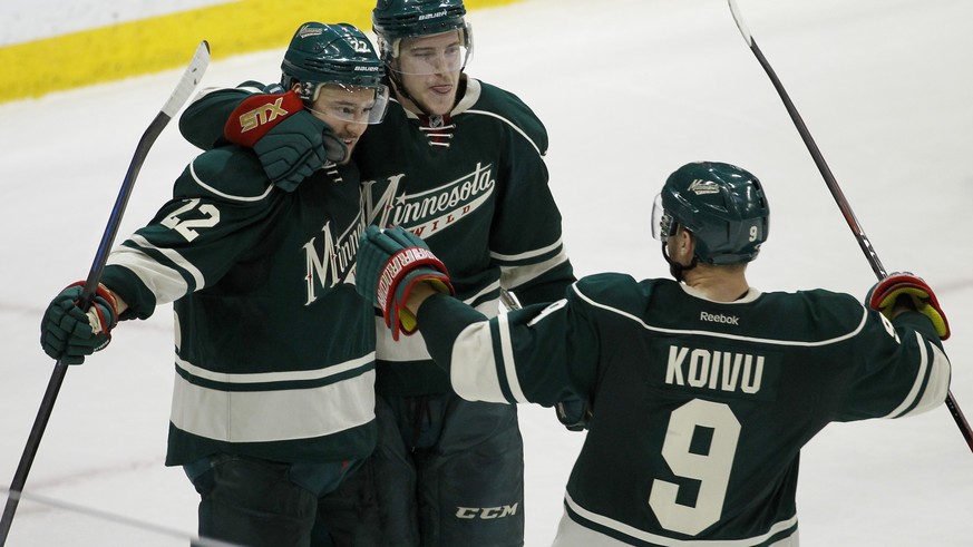 Minnesota Wild right wing Nino Niederreiter , left, of Switzlerand, celebrates with Charlie Coyle, center, and Mikko Koivu (9), of Finland, after Niederreiter&#039;s empty-net goal against the St. Lou ...