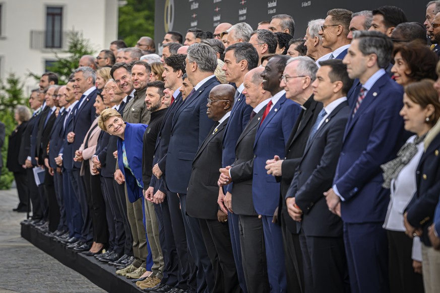 Heads of states pose for a group picture as Swiss Federal President Viola Amherd leans forward during the Summit on peace in Ukraine, in Stansstad near Lucerne, Switzerland, Saturday, June 15, 2024. H ...