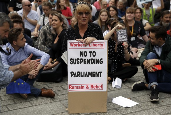 Anti-Brexit supporters gather outside the Prime Minister's residence 10 Downing Street in London, Wednesday, Aug. 28, 2019. British Prime Minister Boris Johnson asked Queen Elizabeth II on Wednesday t ...
