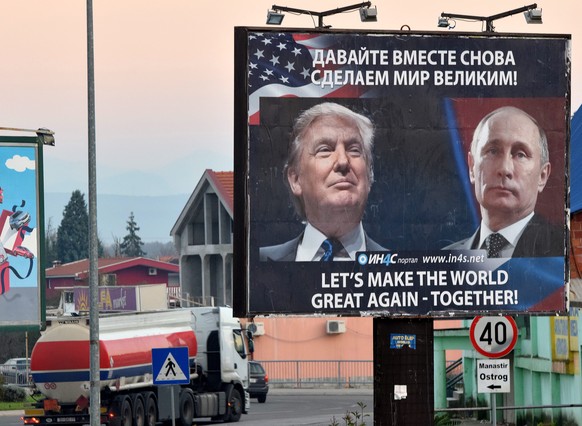 epa05634156 A billboard by pro-Serbian movement shows the image US President-elect Donald Trump and Russian President Vladimir Putin as a truck drives past in the town of Danilovgrad, Montenegro, 16 N ...