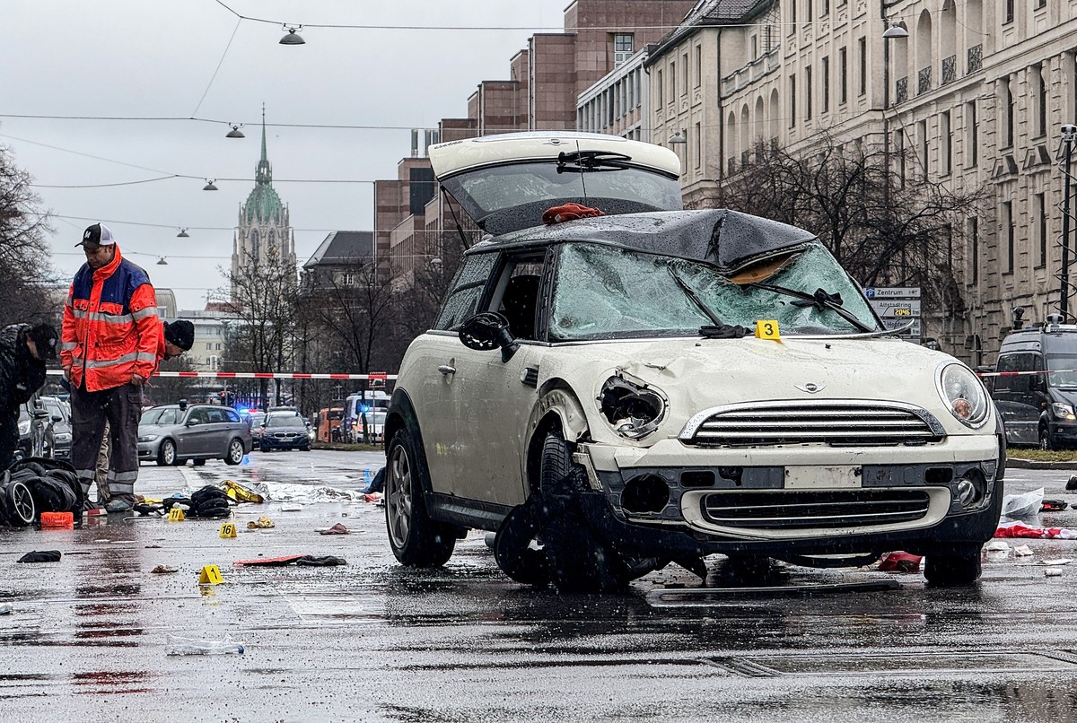 epa11892961 A damaged car is seen at the scene after a vehicle was driven into a Ver.di demonstration in Munich, Germany, 13 February 2025. According to statements from Munich police, at least 28 peop ...