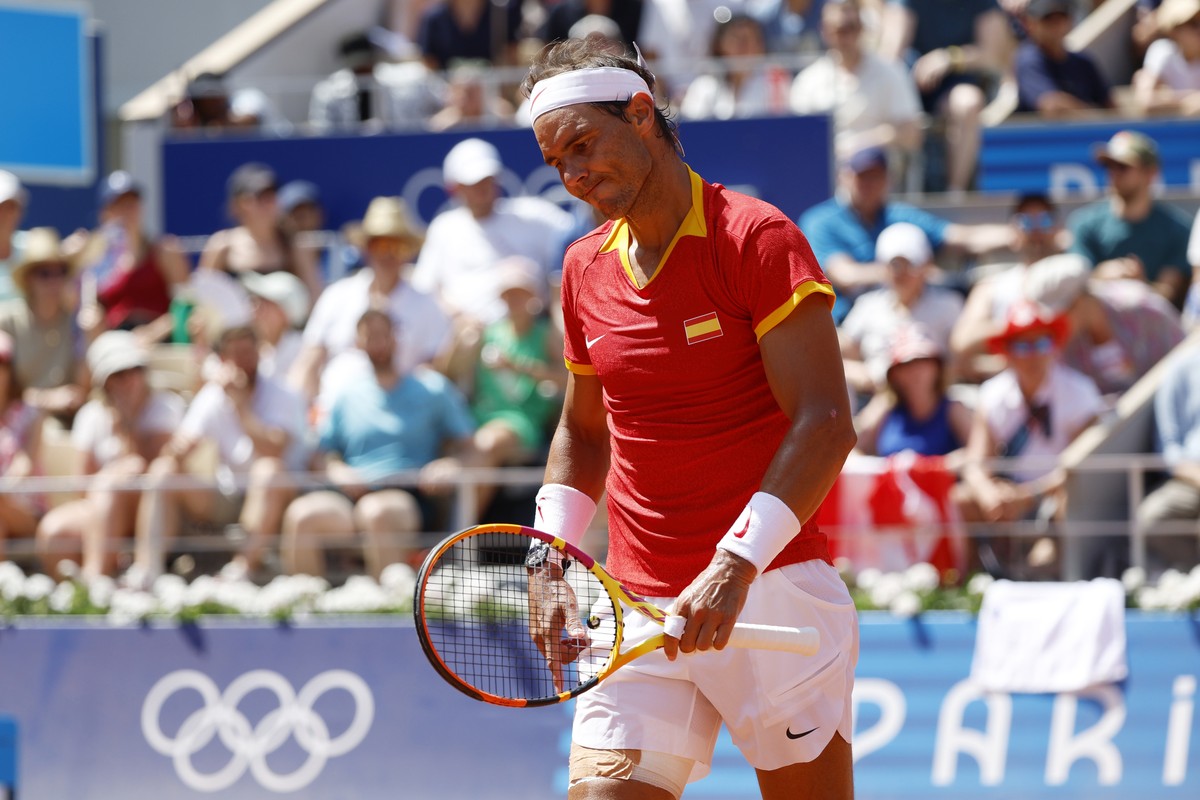 epa11505669 Rafael Nadal of Spain reacts during the Men's Singles second round match against Novak Djokovic of Serbia at the Tennis competitions in the Paris 2024 Olympic Games, at the Roland Gar ...