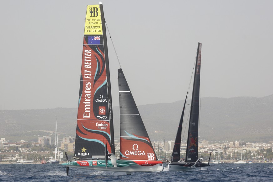 epa10866190 Emirates Team New Zealand (L) and Alinghi Red Bull Team (R) boats in action during the second day of the Preliminary Regatta of the 37th America&#039;s Cup, in Vilanova i La Geltru, Spain, ...