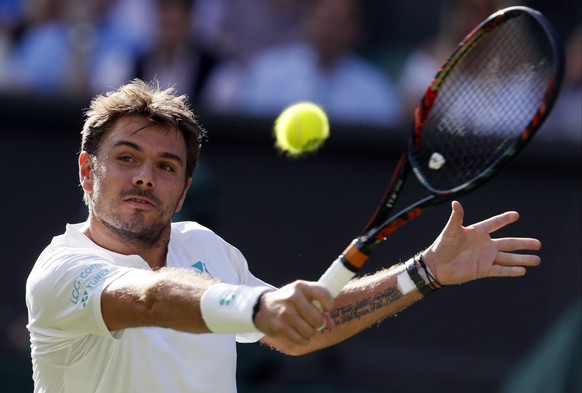 Switzerland&#039;s Stan Wawrinka returns to Russia&#039;s Daniil Medvedev during their Men&#039;s Singles Match on the opening day at the Wimbledon Tennis Championships in London Monday, July 3, 2017. ...