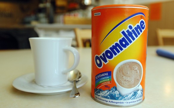 A cup of milk and a can of Ovomaltine are pictured in a restaurant in Bern, Switzerland, on Tuesday, October 8, 2002. Ovomaltine, an icon of all things Swiss, has been sold to Associated British Foods ...