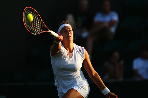 LONDON, ENGLAND - JUNE 30: Stefanie Voegele of Switzerland in action in her Ladies Singles first round match against Madison Keys of the United States during day two of the Wimbledon Lawn Tennis Champ ...