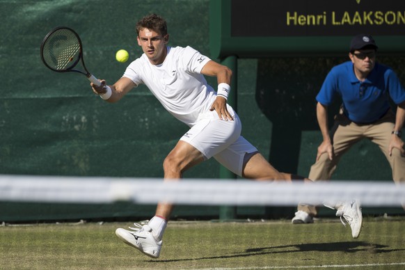 Switzerland&#039;s Henri Laaksonen in action against Jason Jung of Taiwan during the Qualifying competition for the All England Lawn Tennis Championships in Wimbledon, London, Tuesday, June 26, 2018.  ...